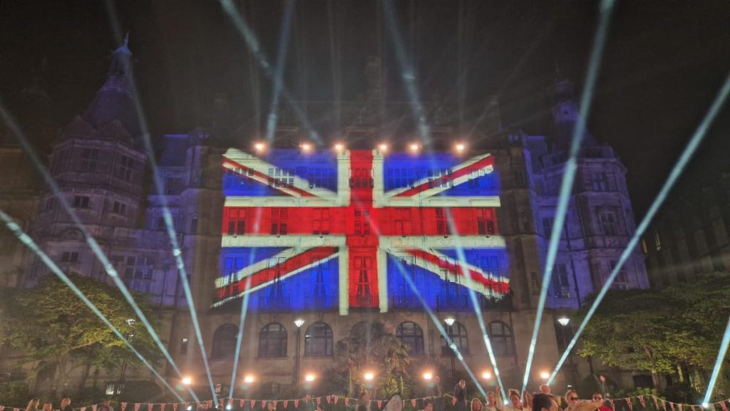 Vari-Lite VL3600 fixtures frame Union Jack Coronation projection